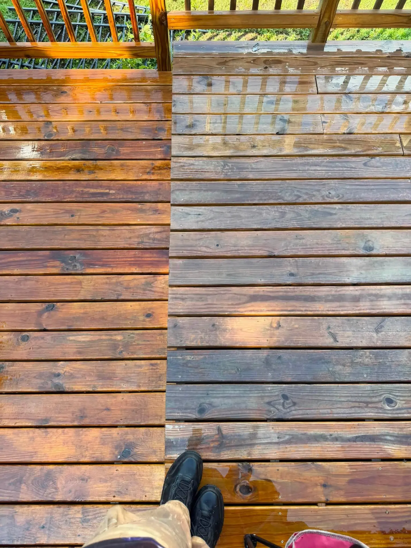 Wood deck half cleaned, showing the washed and unwashed boards side by side
